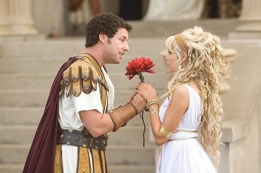 Adam Sandler surrounded by fantasy characters in the family comedy Bedtime Stories
